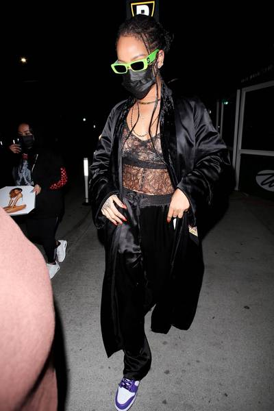 Sultry!&nbsp; - Rihanna&nbsp;looked sexier than ever as she enjoyed a late dinner at Wally's, a Beverly Hills restaurant. Showing lots of skin in a black lingerie top, the business mogul completed the sultry look with silky black sweatpants, a black Hermès Japanese-themed silk coat, purple Nike Dunks, and green Gucci sunglasses. Savage! (Photo:&nbsp;GIO / BACKGRID) GIO / BACKGRID