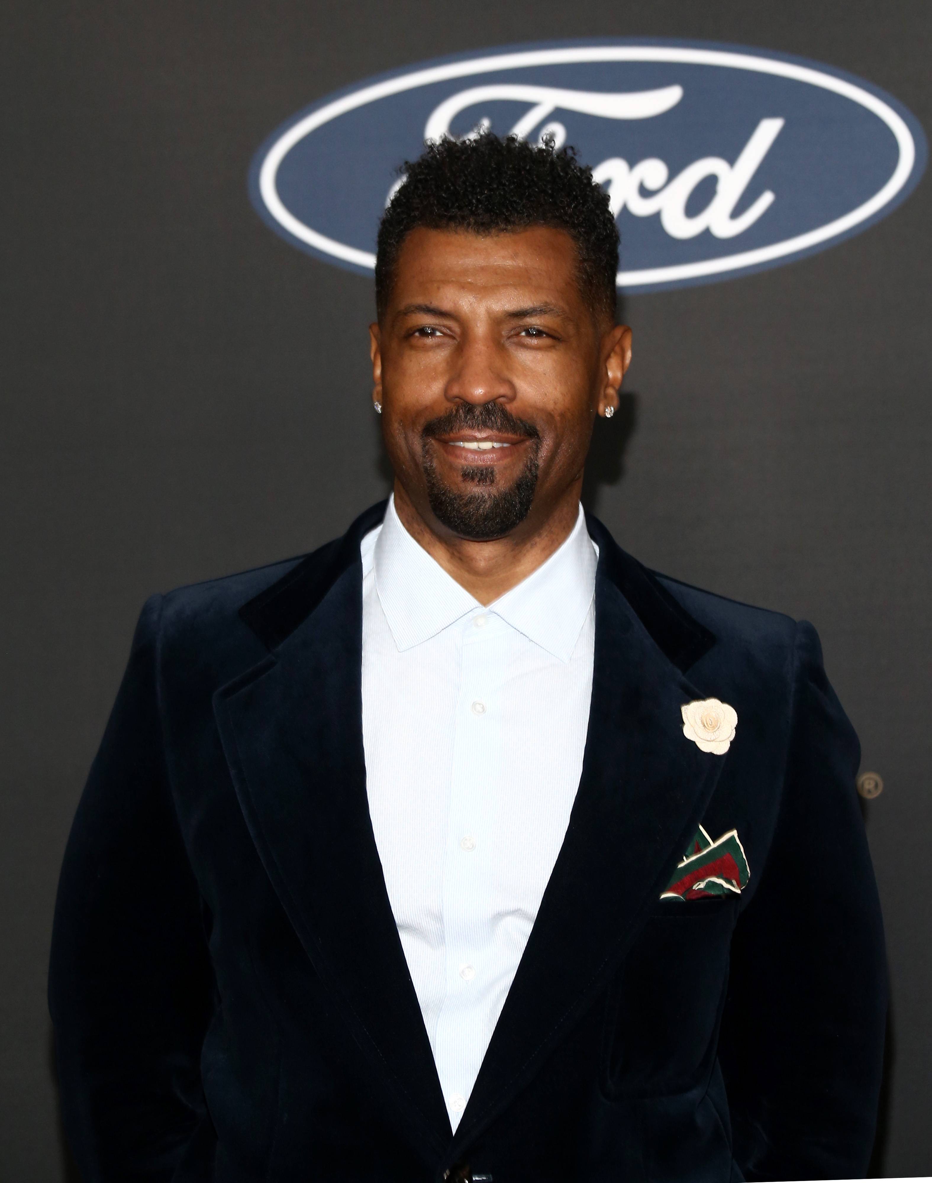 Comedian Deon Cole Defends His Bellbottomed Gucci Suit Against Homophobic  Internet Trolls | News | BET