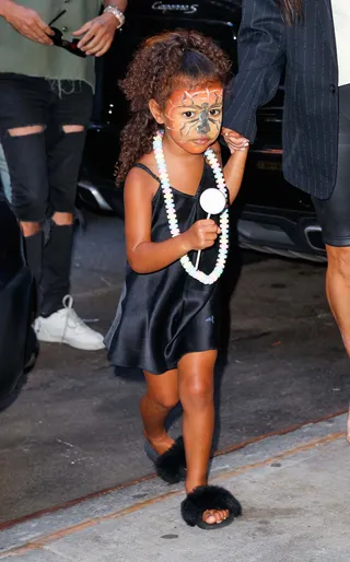 Mask On - Kim Kardashian's mini-me was seen out in NYC with a silk black dress and a face full of face paint. (Photo:&nbsp;Jackson Lee / Prahl Splash News)