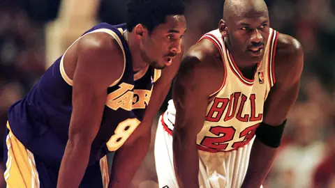 CHICAGO, UNITED STATES:  Los Angeles Lakers guard Kobe Bryant(L) and Chicago Bulls guard Michael Jordan(R) talk during a free-throw attempt during the fourth quarter 17 December at the United Center in Chicago. Bryant, who is 19 and bypassed college basketball to play in the NBA, scored a team-high 33 points off the bench, and Jordan scored a team-high 36 points. The Bulls defeated the Lakers 104-83.  AFP PHOTO  VINCENT LAFORET (Photo credit should read VINCENT LAFORET/AFP via Getty Images)
