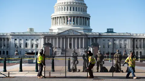 UNITED STATES - JANUARY 7: Workers install more robust fencing along the east side of the U.S. Capitol on Thursday morning, January 7, 2021, following the riot at the Capitol the day before. (Photo By Bill Clark/CQ-Roll Call, Inc via Getty Images)