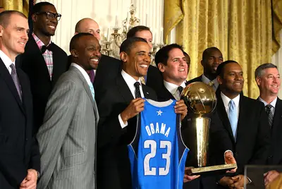 U.S. President Barack Obama holds a Dallas Mavericks jersey as