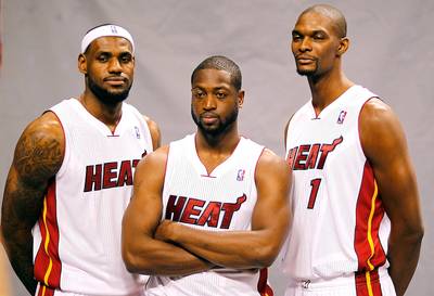 Miami's Big Three Meet - Just as they did in 2010 before all signing with the Miami Heat, the Big Three of LeBron James, Dwyane Wade, and Chris Bosh met to collectively discuss their future on Wednesday, ESPN is reporting. James opted out of the final two years and $42 million of his Heat contract on Tuesday. Wade and Bosh will have until midnight on Monday to decide whether or not they will follow suit. ESPN is also reporting that the Heat want to make an aggressive attempt to move up in Thursday’s NBA Draft to select UConn’s point guard Shabazz Napier. James tweeted during the NCAA title game, which Napier’s Huskies won, in April: &quot;No way u take a PG in the lottery before Napier.&quot; Landing Napier would entince King James to return to Miami, the Heat organization is hoping.&nbsp;(Photo: Mike Ehrmann/Getty Images)