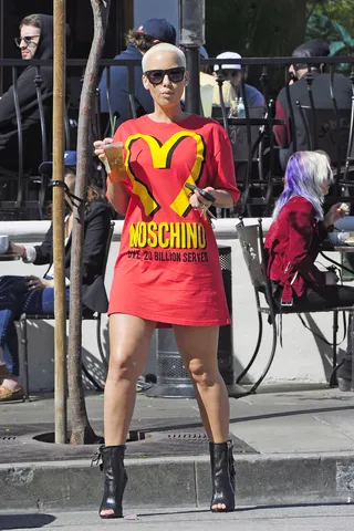 Fun With Fashion - Amber Rose is spotted wearing a Moschino shirt dress mimicking the McDonald's logo as she leaves Urth Cafe in West Hollywood, CA, with a friend.&nbsp;(Photo: EM43 / Splash News)