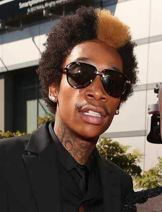 Wiz Khalifa  - Wiz’s former picked-out fro and bleached bangs are clearly “Taylor made” for his rap-rock persona.  (Photo: Christopher Polk/Getty Images)