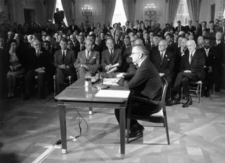 Voting Rights Act of 1965 - On Aug. 6, President Lyndon B. Johnson signed the Voting Rights Act into law, which prohibited literacy tests and other efforts to disenfranchise Black voters.  (Photo: Keystone/Getty Images)