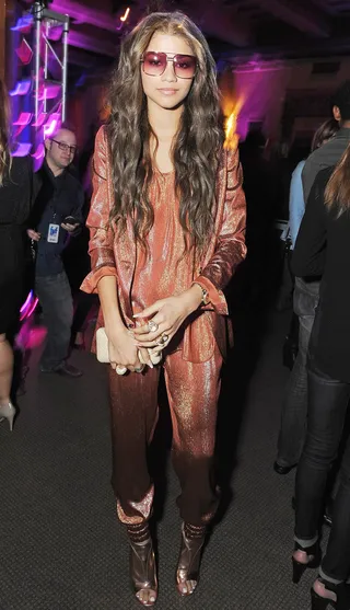 Shine On - The actress flashes her star power in a shimmery Gucci jacket and jogging pants, finishing with rosy frames and relaxed waves. #AllMetallicEverything(Photo: Angela Weiss/Getty Images for FRIENDS 'N' FAMILY)