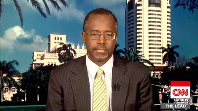Blame It on the Immigrants - Retired neurosurgeon Ben Carson has stepped into the vaccination debate and in the process also stepped &quot;in it&quot; after suggesting that immigrants to the U.S. exacerbate the risk of measles and other epidemics. He defended his position in a CNN interview. &quot;It?s not to prejudice anybody, but we have to deal with reality, and if you have people coming into your country who have not been properly screened, who have not had the same kind of care as people in this country, I don?t think you have to be a genius to figure out that that could introduce some communicable problems,&quot;&nbsp;Carson said.&nbsp;(Photo: CNN)