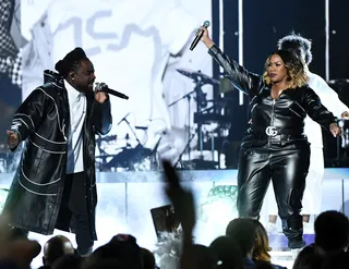 Wale and Kelly Price vibe off each other at the Soul Train Awards. - (Photo by Ethan Miller/Getty Images for BET)
