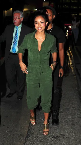 Party Starter - Karrueche Tran&nbsp;looks single and happy as she arrives at Hooray Henry's rocking a cute army green jumper and metallic gold heels in Beverly Hills.(Photo: DutchLabUSA / Splash News)
