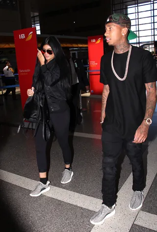 Perfectly Matched - Soon to be 18 years old, Kylie Jenner arrives at LAX airport with her 25-year-old male companion,&nbsp;Tyga, rocking coordinating ensembles to catch a flight out of town.&nbsp;(Photo: Bauer-Griffin/Bauergriffin.com)