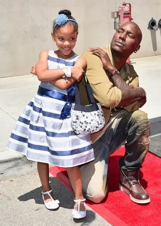 Kickin' It With My Daddy - Tyrese Gibson and daughter Shayla Somer Gibson pose for a pic at the premiere press event for the new Universal Studios Hollywood Ride Fast &amp; Furious-Supercharged in Universal City.(Photo: Alberto E. Rodriguez/Getty Images)