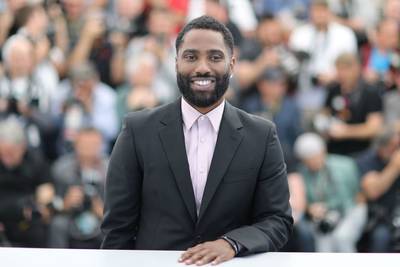 John David Washington - When you’re the son of Denzel Washington, it’s inevitable that people will compare your acting skills to those of your father. Fortunately, John David, 36, doesn’t disappoint. The former football pro starred in Christopher Nolan’s sci-fi thriller, Tenet, the first major movie to be released during the pandemic. The film grossed $300 million worldwide, cementing Washington’s status as a huge star, in his own right. (Photo by VALERY HACHE/AFP via Getty Images)