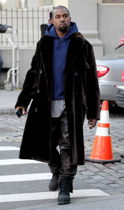 Personal Style - Kanye West is spotted strolling the streets of NYC wearing a full-length double breast coat in a velvety fabric.&nbsp;&nbsp; (Photo: Ralph, PacificCoastNews.com)