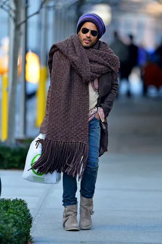 Baby, It's Cold Outside - Lenny Kravitz fights the winter chill with a giant scarf and knit hat as he does a little shopping in the Greenwich Village neighborhood of New York City.(Photo: PacificCoastNews.com)