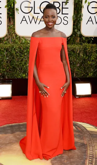 Lupita Nyong'o - The 12 Years a Slave star continues her red carpet winning streak in this scorching hot Ralph Lauren cape gown.   (Photo: Jason Merritt/Getty Images)