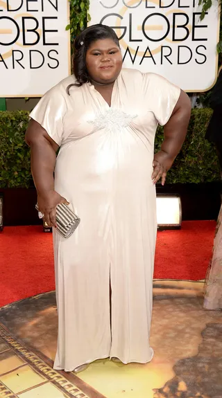 Gabourey Sidibe - The American Horror Story star teams her shimmery Daniel Musto with Michael Costello gown with glamorous barrel curls and an embellished Deepa Gurnani clutch.  (Photo: Jason Merritt/Getty Images)