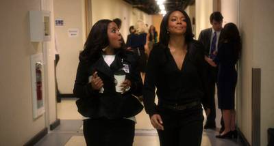 Office Runway - Mary Jane is one of the faces of SNC, so it helps for her to look good while shining on TV. Here she's rocking a simple black, silk jumpsuit number as she walks with one of her girlfriends, Michelle (played by Brely Evans), who seems to be coodrinating with her in a black peplum jacket.&nbsp;(Photo: BET)
