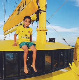 Just Call Him Captain - Young Julez is no doubt the freshest captain on the sea in his sunny soccer jersey and turquoise trunks.  (photo: Solange Knowles via Instagram)