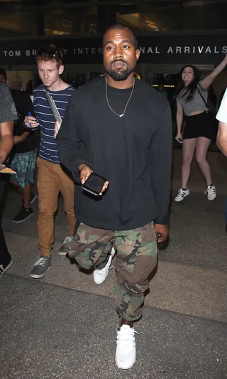 When Fans Attack - Kanye West is mobbed by autograph collectors as he makes his way to a waiting limo in Los Angeles.(Photo: Splash News)