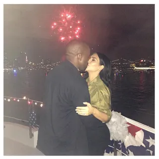Kim Kardashian @kimkardashian&nbsp; - Kimye's spark certainly hasn't fizzled! The couple spends the Fourth of July sharing a kiss while watching fireworks. (Photo: Kim Kardashian via Instagram)