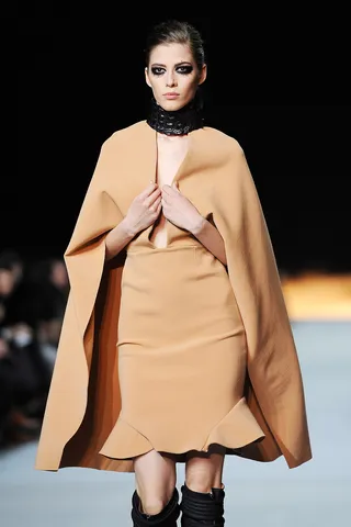 Super Style - This nude cape look wasn’t a show favorite (some attendees slammed it in particular for being ill fitting) but offered some color and silhouette range for the designing rapper’s collection. (Photo: Pascal Le Segretain/Getty Images)