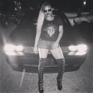 Okay 90s - Elite looks like she jumped out of a Jodeci video as she stands posted up against a car in this quick photo.&nbsp;(Photo: Eilte Noel via Instagram)