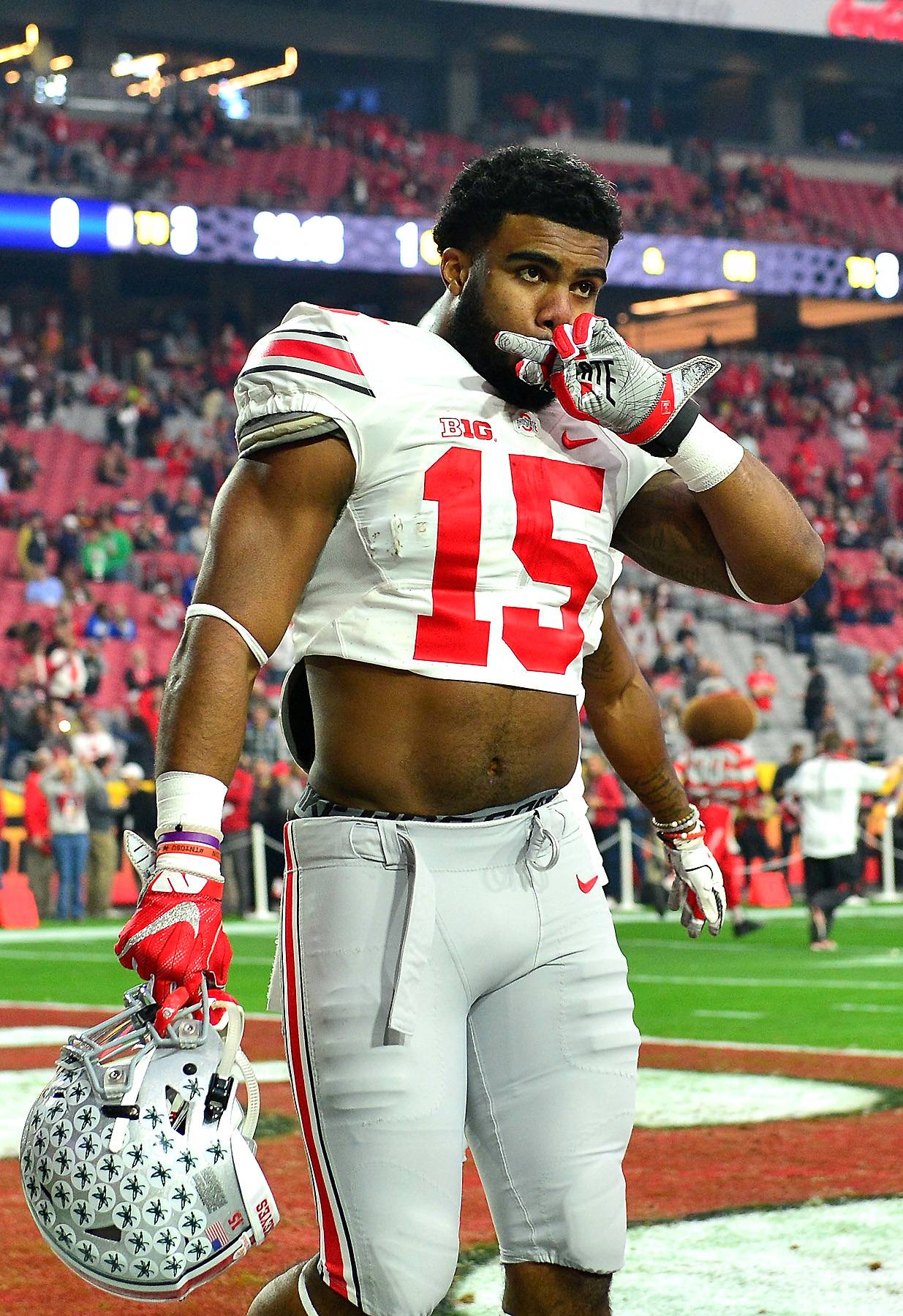 Ezekiel Elliott brings his trademark 'hero in a half-shirt' look to the NFL  Draft