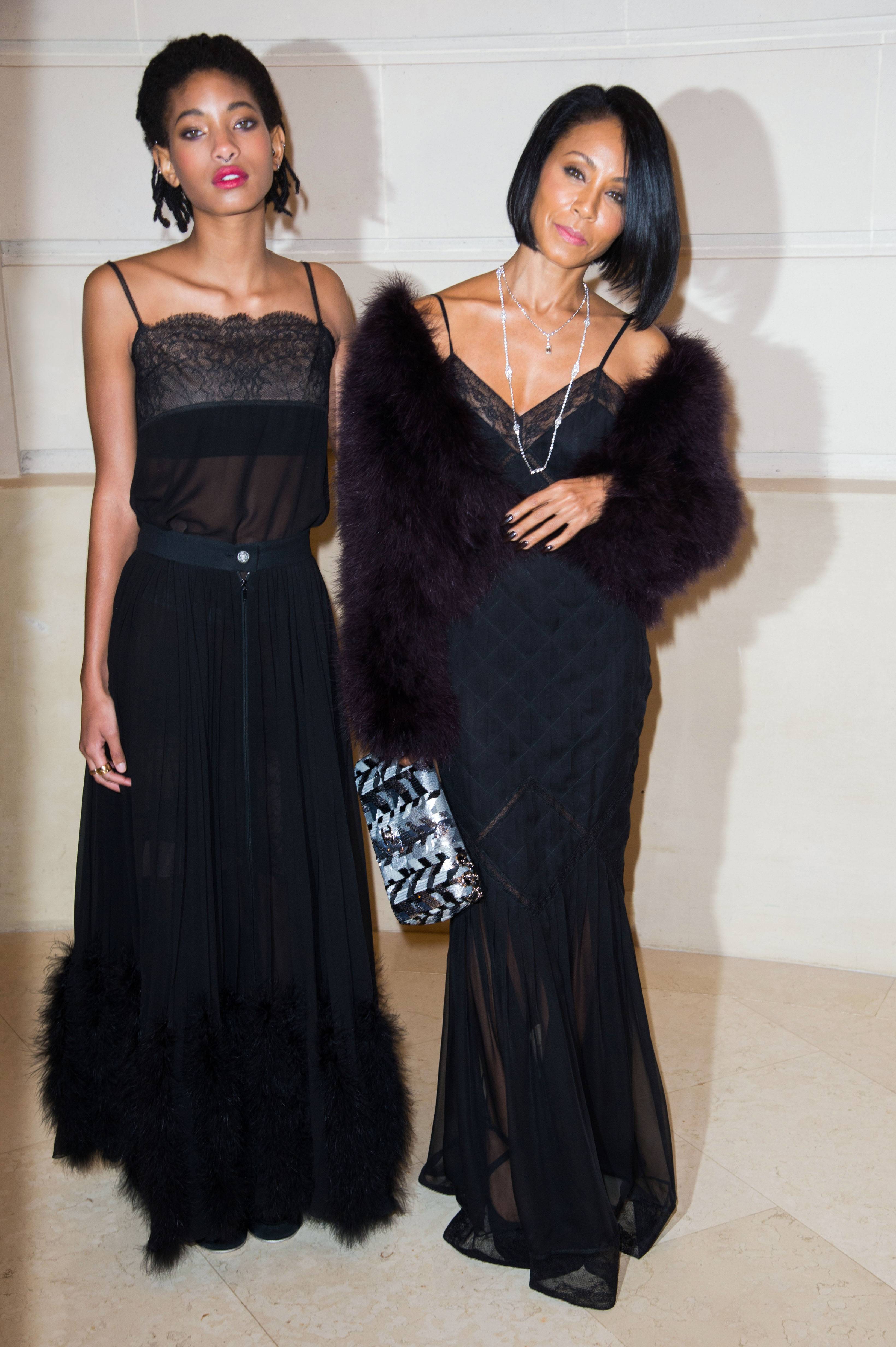 PARIS, FRANCE - DECEMBER 06:  Willow Smith and Jada Pinkett Smith attend the "Chanel Collection des Metiers d'Art 2016/17 : Paris Cosmopolite" show on December 6, 2016 in Paris, France.  (Photo by Stephane Cardinale - Corbis/Corbis via Getty Images)
