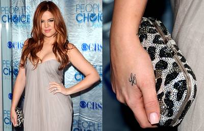 Khloe Kardashian - It seems that less is more and small is sexy for reality star Khloe Kardashian. She has four tiny tattoos on her body, including the letters &quot;L O&quot; on her right hand, which are the initials of her husband Lamar Odom.  (Photos: Jason Merritt/Getty Images; Jason Merritt/Getty Images)