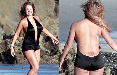 Mariah Carey - It’s no secret that Mariah Carey is a fan of butterflies, and the beautiful singer expresses her love for the fluttery creatures with a colorful tattoo on her lower back.  (Photos: PacificCoastNews.com)