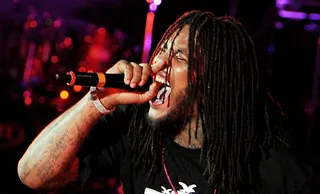 The Evolution of Waka Flocka Flame - Unfortunately, Waka's become all too familiar with Biggie's &quot;Mo Money, Mo Problems&quot; mantra. The rapper was robbed and shot in January 2010, and in 2011 was caught up in a handful of public brawls. Hard in da paint, indeed.(Photo: Kevin Winter/Getty Images)