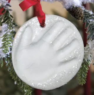 Baby Handprint Ornament Kit ($12.95) - Open this no-mess ornament casting kit early and create a keepsake that can hang on the tree this — and every — year.&nbsp; (Photo: One Step Ahead)