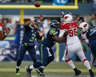 Seahawks Smack Cardinals - The defending champion Seattle Seahawks kept their chances of winning the NFC West division alive by scoring a 19-3 home rout of the Arizona Cardinals on Sunday. Russell Wilson threw for 211 yards and a touchdown in the win.&nbsp;(Photo: Otto Greule Jr/Getty Images)