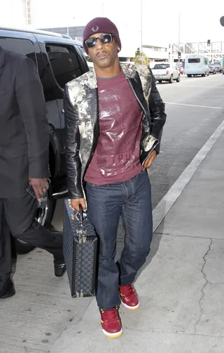 Sky High - Katt Williams departs LAX airport in Los Angeles with his Louis Vuitton suitcase in hand.(Photo: Splash News)