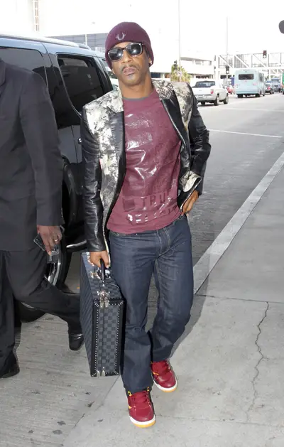 Sky High - Katt Williams departs LAX airport in Los Angeles with his Louis Vuitton suitcase in hand.(Photo: Splash News)