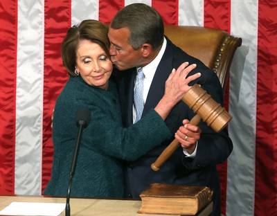 Fifty Shades of Nay - After Ohio Rep. John Boehner was re-elected to a third term as House speaker, he leaned in to kiss Minority Leader Nancy Pelosi as she handed him the speaker's gavel. But instead of offering him her cheek, the California lawmaker seemed to recoil, setting off a series of tweets and jokes on cable news programs, many of which focused on Boehner's perpetually deep tan.    (Photo: Mark Wilson/Getty Images)