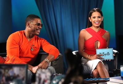 'Let the (Great) Times Roll' - Nelly and Rocsi Diaz can't stop laughing.&nbsp; (Photo: Maury Phillips/WireImage)