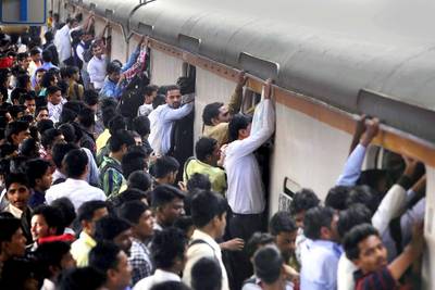 Mumbai Train Commuters Rampage Station - Violent protests erupted at a train station in Mumbai, India on Friday morning. The Hindu reported that a mob of commuters angered by train delays pelted stones at the trains, vandalized railway property and set three vehicles, including a police car, on fire. At least one person—a railway worker—was injured in the stone throwing incident. Railways Minister Suresh Prabhu has reportedly promised to look into the commuters’ demands and will be launching an inquiry in the protests. (Photo: Kalpak Pathak/Hindustan Times via Getty Images)