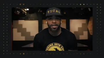 Legendary rapper Method man in a black and yellow t-shirt and hat.