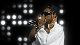 Lil Wayne provided the bling at the awards with eye-catching bracelets and a giant diamond ring. - (Photo: BET) (Photo: BET)