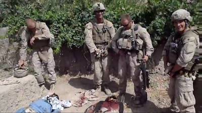 Video Believed to Show U.S. Marines Urinating on Deceased Iraqis - The U.S. Marine Corps has launched an investigation into four men in uniform who appear to have been caught on camera urinating on the corpses of three Taliban fighters. The disturbing video surfaced on Jan. 11, 2011, and, according to U.S. Marine Corps officials, all four soldiers have been identified. Their names have not been released, but they are reportedly the 3/2 Marine battalion out of Camp Lejeune, which was stationed in Afghanistan last summer. Should the video prove legitimate, it would be a direct violation of the Geneva Convention, which calls for the dead to be &quot;honorably interred&quot; and graves to be &quot;respected,&quot; in addition to the U.S. Uniform Code of Military Justice for allegedly bringing &quot;discredit upon the armed forces.&quot;\r(Photo: Reuters)