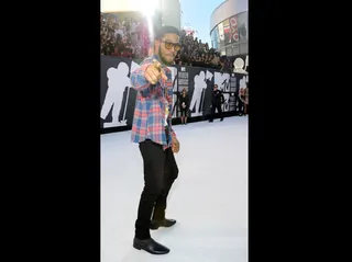 Kid Cudi - Kid Cudi hit the scene in a plaid button-down shirt and black jeans.&lt;br&gt;&lt;br&gt;&lt;b&gt;(Photo Credit: PictureGroup)&lt;/b&gt;