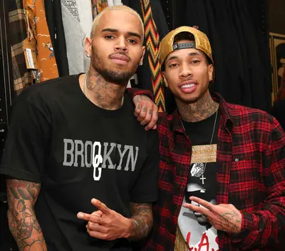 'Ayo' - Tyga and Breezy reconnect with producer Nic Nac for another &quot;Loyal&quot; smash with &quot;Ayo.&quot; Owning the world right now and not ashamed to be winning, The Last King &nbsp;sets the track off with bars like, &quot;Yeah, I'm the coldest n***a, icy /&nbsp;Looking in the mirror like I wish I can be me / She too into me, I'm more into money / My hobby's her body, that p***y's my lobby.&quot;(Photo: Imeh Akpanudosen/Getty Images)