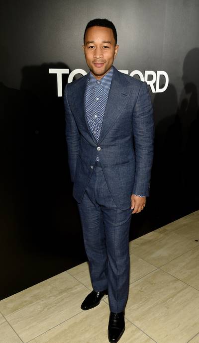 Riding Solo - John Legend looks dapper in his suit but is missing his best accessory, wife Chrissy Teigen.  (Photo: Dimitrios Kambouris/Getty Images for Tom Ford)