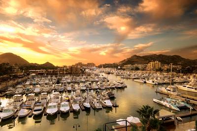 Cabo San Lucas, Mexico - Why: It’s sexy and far away from the Spring Breakers that it offers grownfolk good-time fun.&nbsp;How: A 4-day all-inclusive package, with loft accommodations and airfare included, can be found for under $800 per person. Travelers can get 5-star package deals for $1,000. This makes more sense as hotels can run $600 a night.&nbsp;&nbsp;To do: Take a catamaran tour to Land’s End during the sunset, when walruses step out to graze. Party hard in the city’s most famous club Cabo Wabo or the sexy Nikki Beach Los Cabos. Get adventurous and ride ATVs through the dessert and over beach sand dunes for about $100.&nbsp;Stay: Resorts, resorts, resorts. If the vacation is booked as a package, the trip is all-covered.&nbsp;When: On average year-round, Cabo drops no lower than 60 and peaks no higher than 95 degrees. Storms are known to hit late in the summer months. To b...