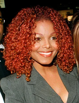 Red Velvet - Janet’s wild side was revealed when she dyed her hair red during the Velvet Rope Tour.(Photo: Brad Rickerby/Reuters)