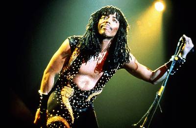 Rick James\r\r - He was Rick James, b—ch. And yes his beaded extension braids and long curls were stunting on a lot of ladies in the ‘70s. If you look back through his flashy, body-hugging animal print and sequined outfits, you’d definitely find more than a few pieces that a woman could wear to be on trend today. We’d also wear some of his over-the-knee boots. \r\r(Photo: Glenn A. Baker/Redferns/Getty Images)