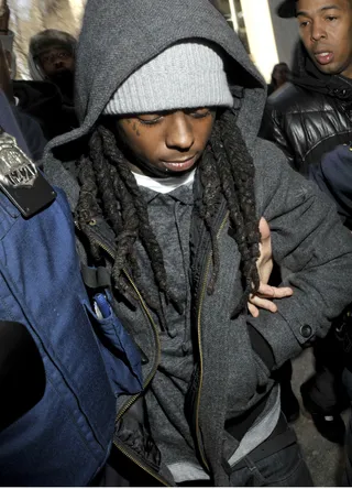 Lil Wayne Jailed - Lil Tunechi's reign at the top came under siege when the rapper was convicted for gun possession and sentenced to a year at Rikers Island in New York. Would he recover?  (Photo: Michael Dominic /Landov)