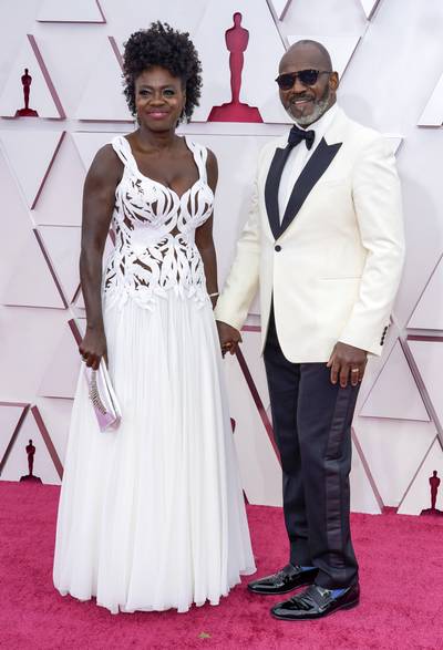 Viola Davis and Julius Tennon&nbsp; - Viola Davis and Julius Tennon look stunning at the 93rd Annual Academy Awards. The lovely couple walked the carpet in the matching white looks. Viola stunned in a white lazer cut Alexander McQueen gownwhile her husband wore a black and white tuxedo. We love how they show love and PDA on the carpet. (Photo by Chris Pizzelo-Pool/Getty Images)